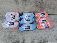 All nine ribbon-tied sock pairs laid out by colour group