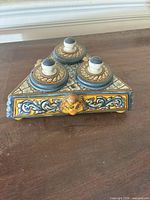 overall view of triangular ceramic inkwell with three lidded pots