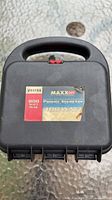 Closed black carry case with Vector MAXX SST 400W label