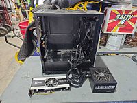 PC case, GPU and PSU together on table