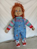 Full view of Chucky doll standing upright