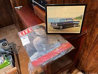 Framed car print and bagged Life magazine together
