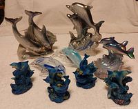 All nine dolphin figurines grouped