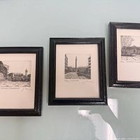 All three framed etchings side-by-side