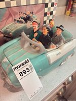 Front view of ceramic convertible cookie jar and box