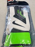 Front view of packaged Nike GK Classic gloves showing color and design