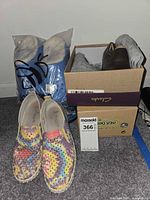 Bagged and boxed view showing all shoes together