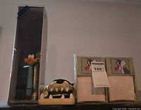Overall lot: boxed feather duster, Tasmanian Devil head, two sealed Sylvester panels