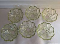 Top view of all six bowls showing swirl pattern and scalloped rims