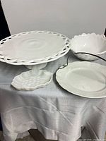 All four white serving pieces grouped