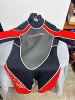 Bare shorty wetsuit front view showing color scheme and logo