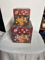 Stacked view of both floral boxes showing design and size difference