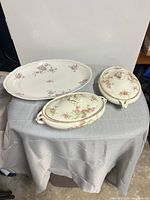 Three-piece Ramona pink roses porcelain serving set showing platter and two covered dishes