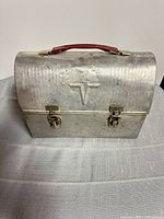 Front view showing embossed T logo and double latches