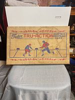 Graphic lid of Tudor Tru-Action electric football box