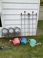 Full lot showing trellises, border panels, three watering cans and sprinkler