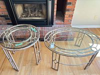 Both nesting tables in front of fireplace showing relative size