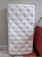Full view of twin Beautyrest Riverdale mattress standing upright