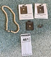 Group shot showing necklace, three Lindenwold stone packages, and blue stone ring