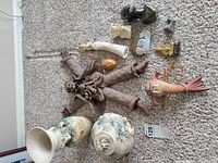 Group shot showing all ceramic and clay items laid out for count and scale