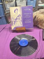 Record and sleeve displayed on table