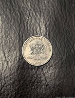 Obverse view showing coat of arms and date