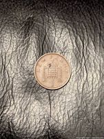 Full view of reverse side with portcullis design and NEW PENNY legend