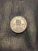 Obverse side with national coat of arms and denomination