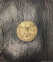 Reverse showing denomination, motto, sprigs, date 1989