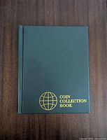 Front cover showing gold globe and title