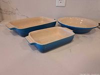 Top view of all three Le Creuset stoneware pieces