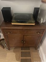 Front view showing entire sideboard with drawer and cabinet doors