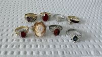 All nine rings front view showing stones and settings
