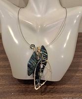 Necklace on bust showing overall design and hang