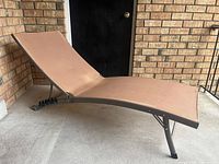 Side view showing entire curved lounge chair