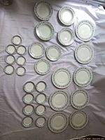 All 30 porcelain pieces laid out by size