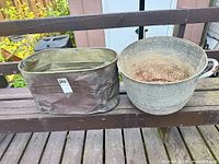 Copper boiler and galvanized bucket side-by-side on bench