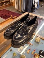 Overall view of both loafers showing upper, leather finish and style