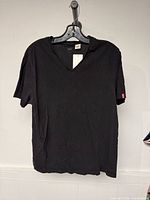Front view of black Levi's V-neck T-shirt on hanger