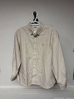 Front view of Nordisk striped shirt on hanger