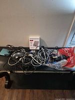 Overview of boxed scale and mixed cable bundle on table