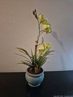 Full view of faux orchid in pot