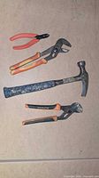 All four hand tools laid out