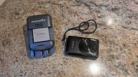 Digipower charger with Canon NB-4L battery and Canon PowerShot SD780 IS camera front