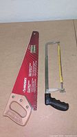 Front view of both saws showing handles and blades