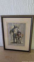 Full view of framed print showing image, mat, glass and wood frame