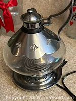 Assembled glass percolator on chrome heating base