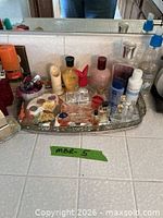 Tray with assorted fragrances, candles and holder