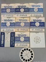 Nine View-Master sleeves and one loose reel laid out