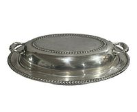 Side view of silver-plate oval serving bowl with lid showing rope border and handles